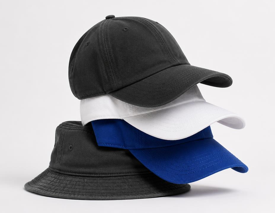 Stacked branded baseball caps and a bucket hat